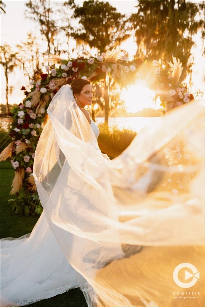bride with veil blowing in the wind