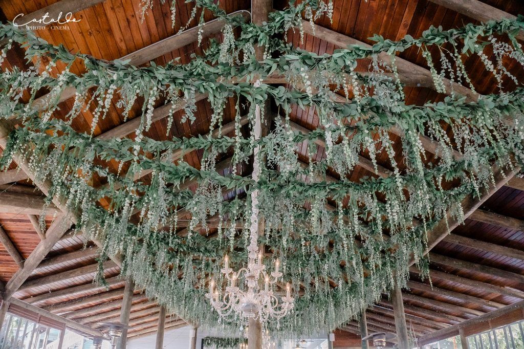 full floral ceiling installation at wedding reception venue
