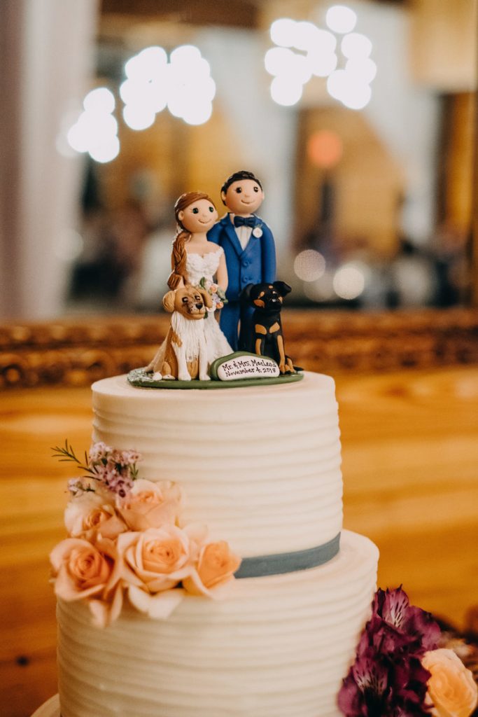 wedding cake topper of couples dogs