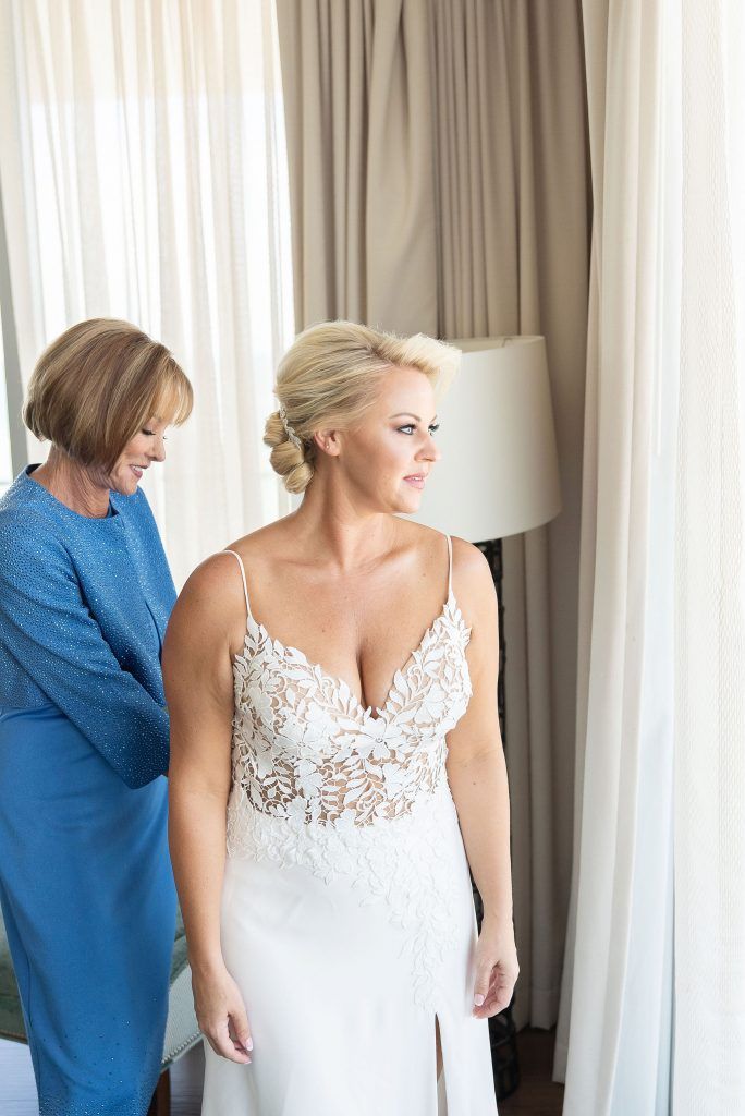 Mom of Bride helps bride get ready at Opal Sands