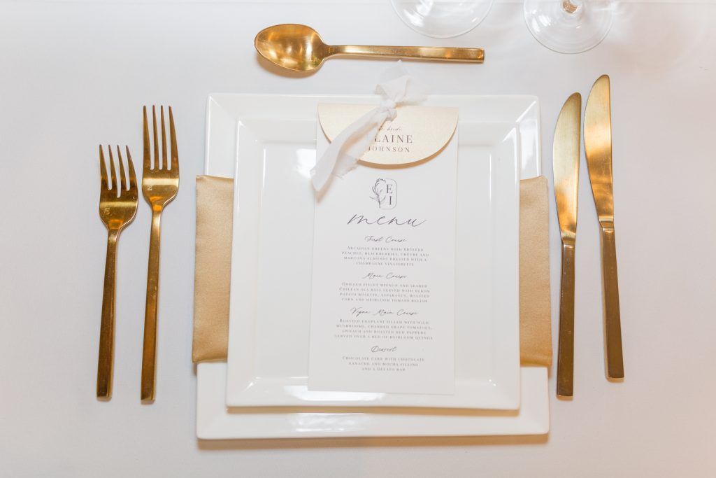 elegant gold and white wedding reception table setting