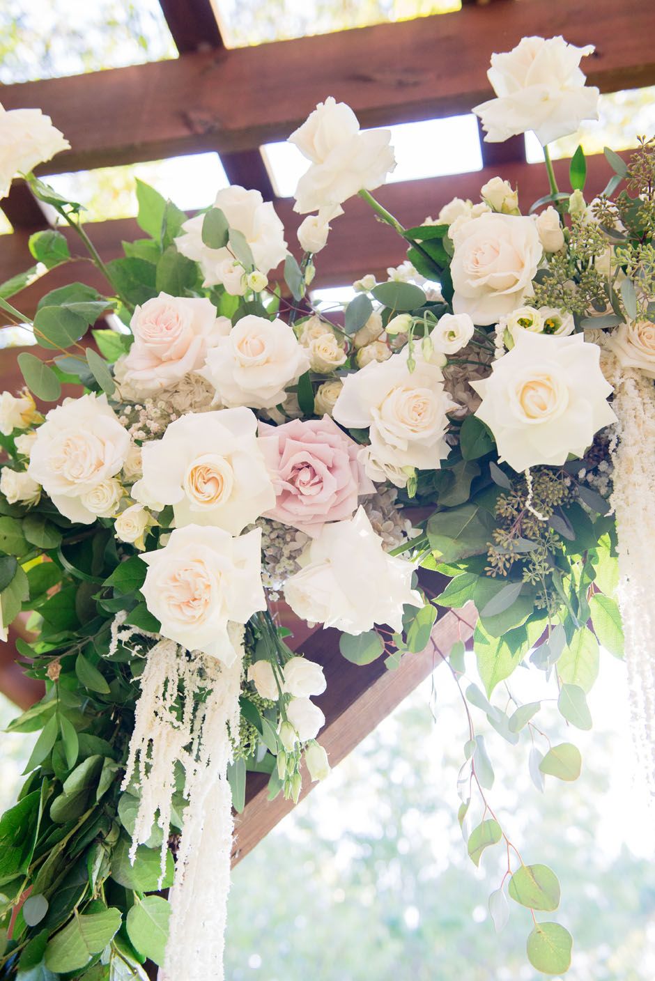 floral detail on wedding arch for a rustic ranch wedding