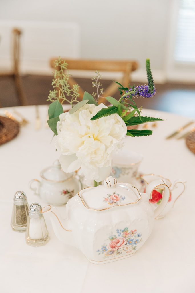 decorate table with teapots for Bridgerton Wedding reception