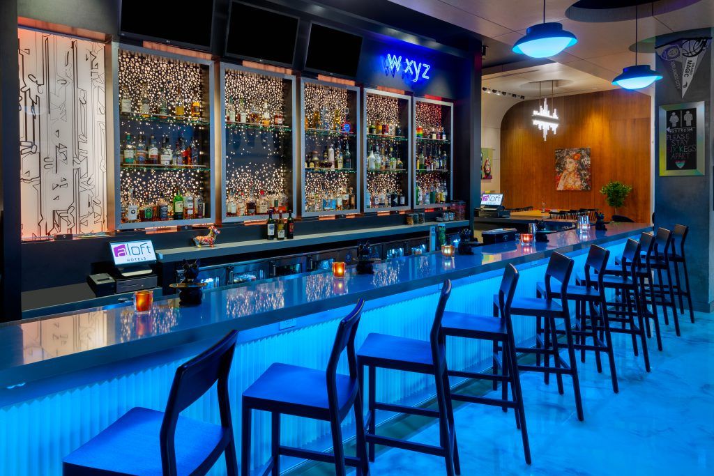 Moody and deep ocean blue lighted bar at Aloft Orlando Downtown