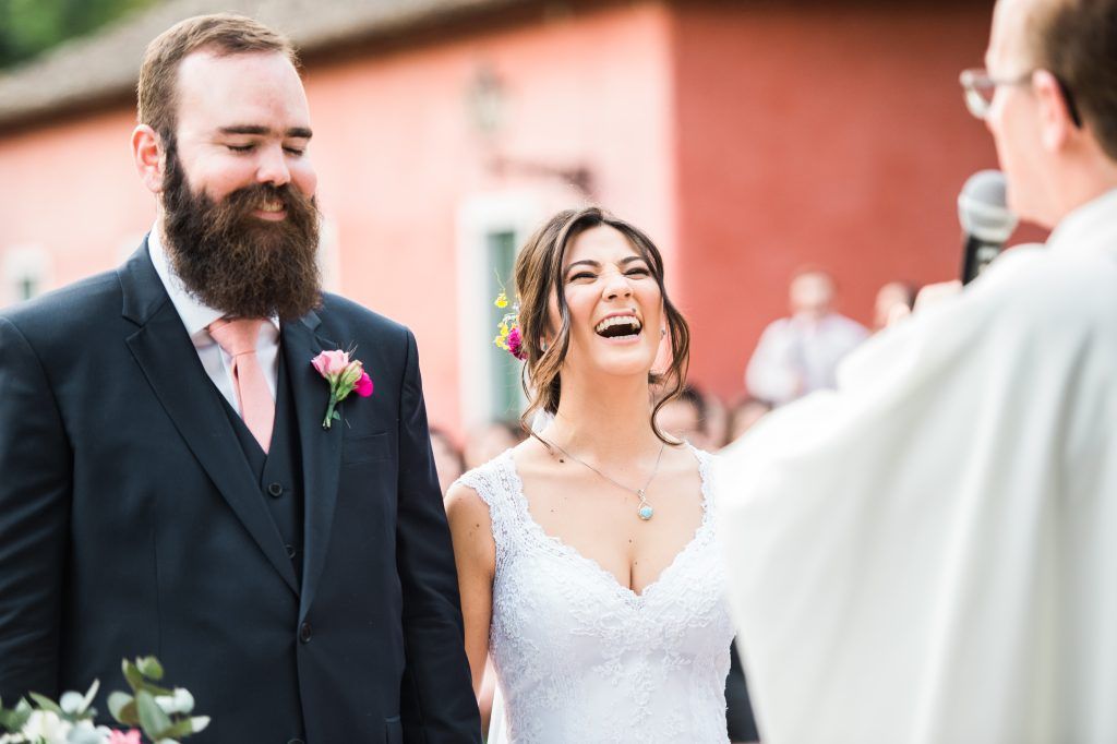 Married couple smiling and laughing at the alter on I Said Yes! FL