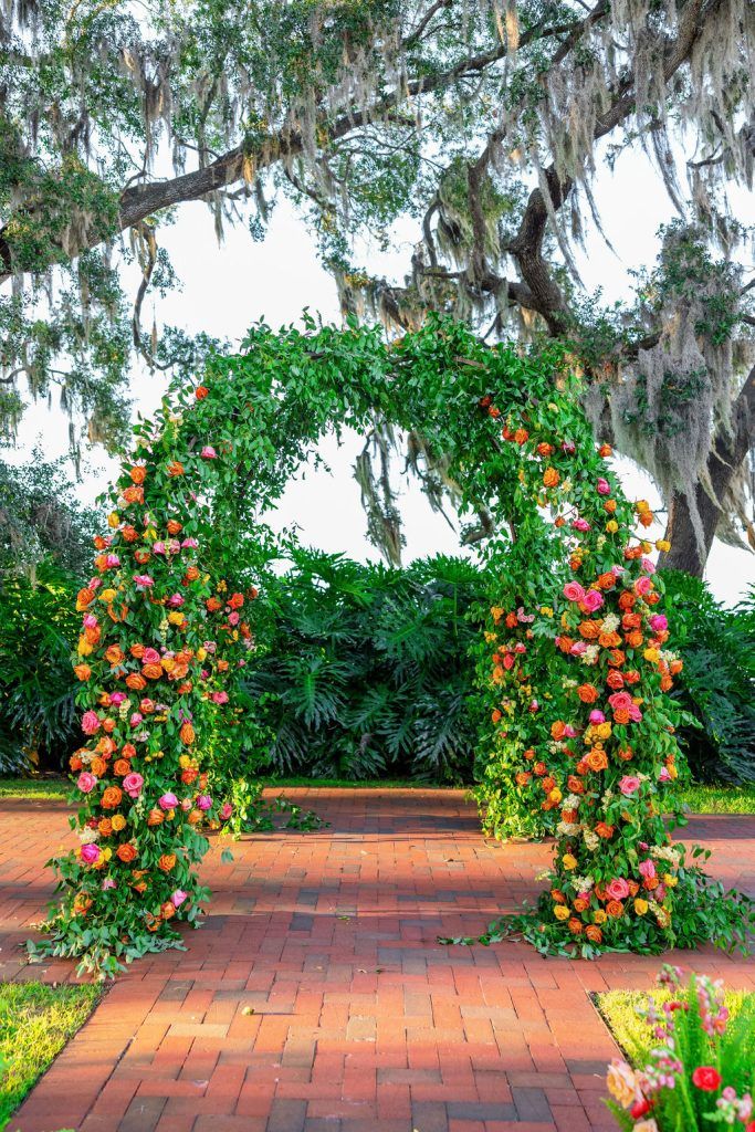 lush green and spring floral wedding arch by jill heaton event decor